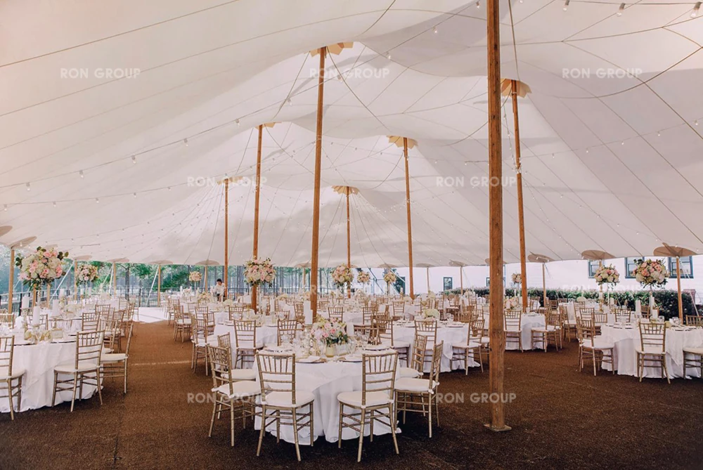 John Gandy Events Marquee Tent Setup with white tables and chairs