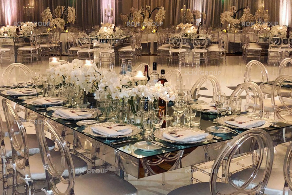 Modern clear resin phoenix chairs with mirror table for a glam event